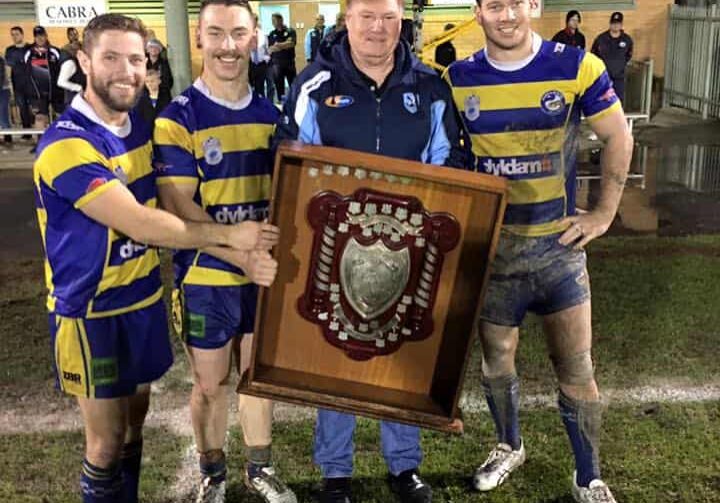 1aaa Sam O'Brien, Corey White, Rhys Walpole receiving Fred Hansen Shield from Deputy Commissioner Jeff Loy.